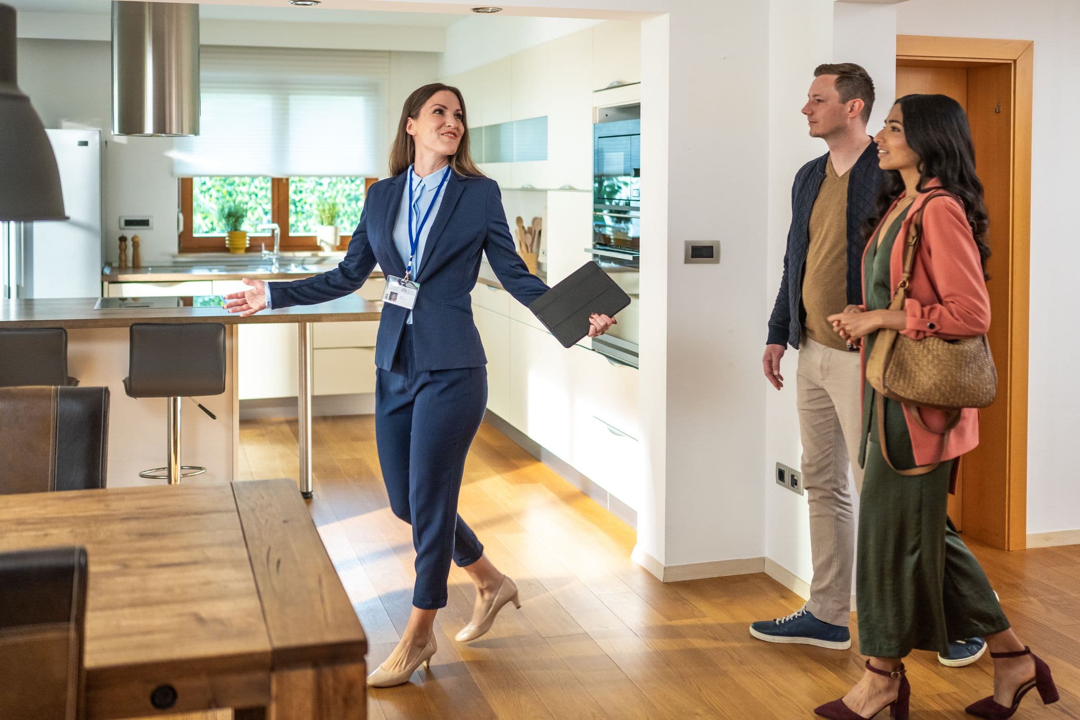 Real estate agent showing a home to prospective buyers