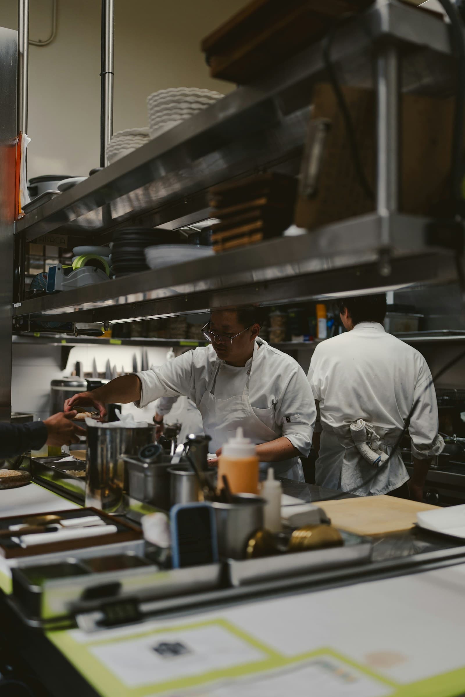 Restaurant chefs preparing food during service