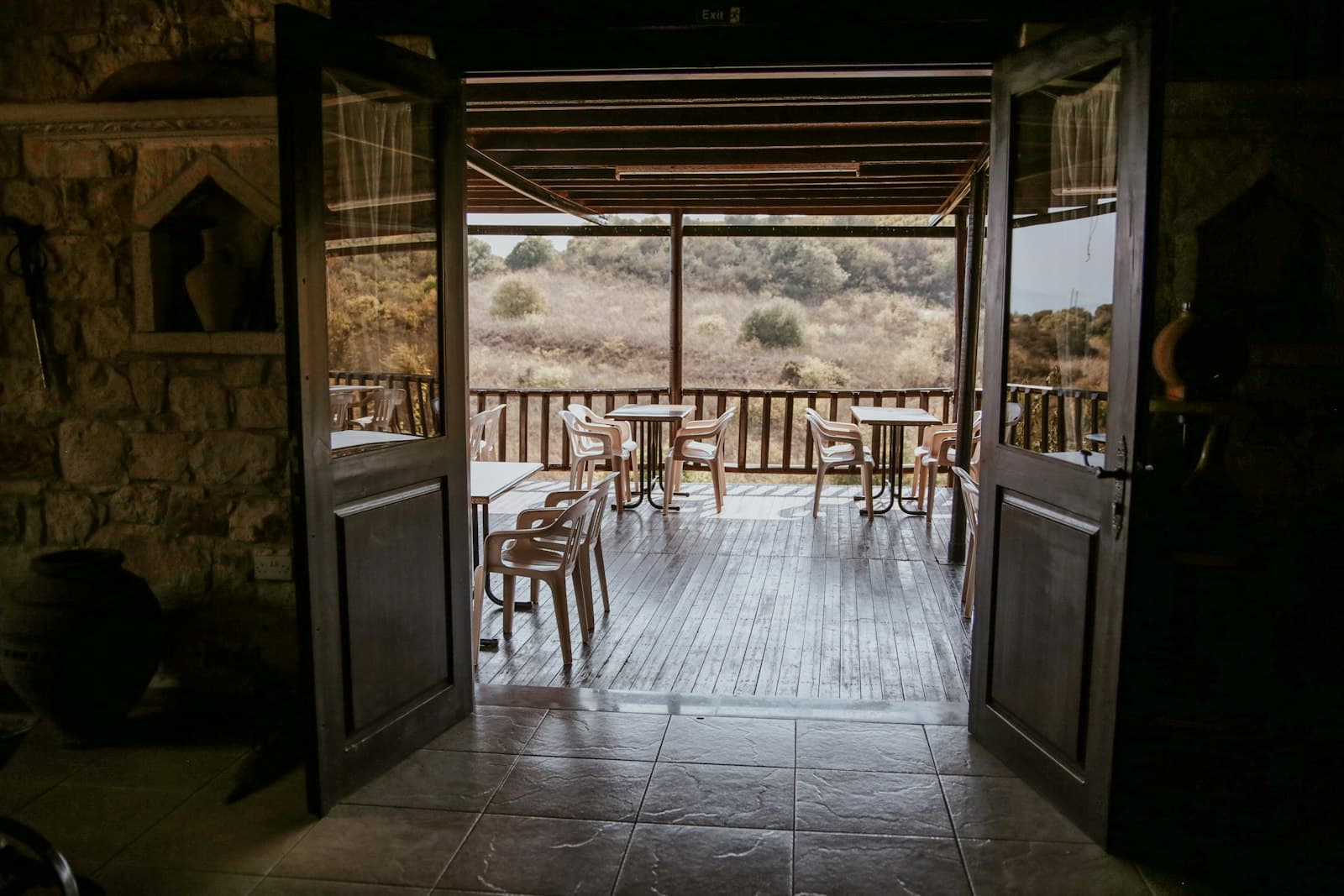 Cozy restaurant dining terrace set for service